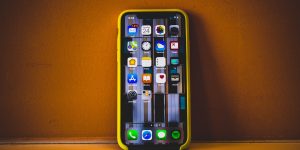 picture of an iphone on a yellow painted wall