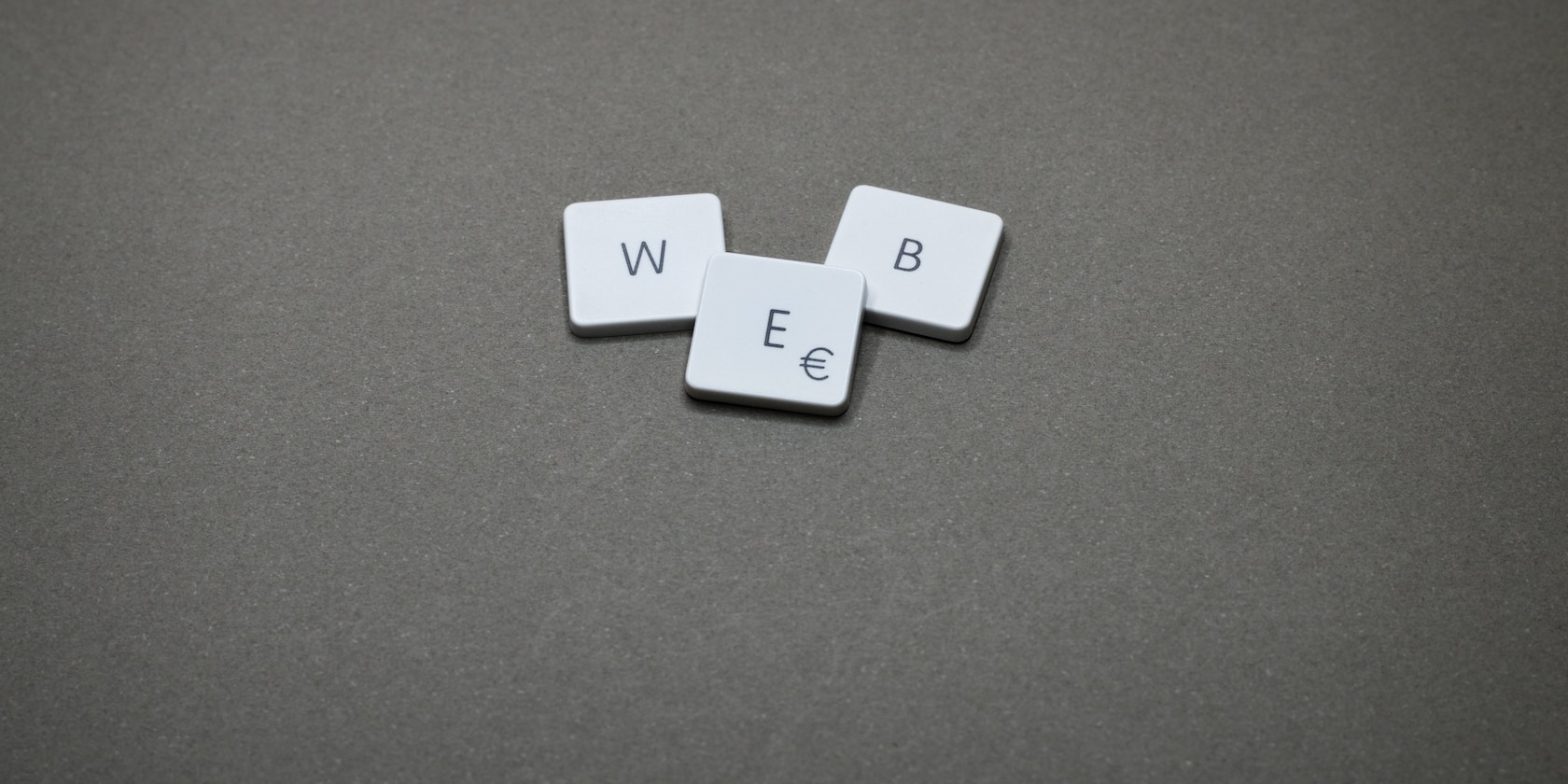 tiles on a greyboard showing the word WEB